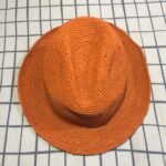 Madagascar orange handcrafted fedora hat made from premium quality raffia.